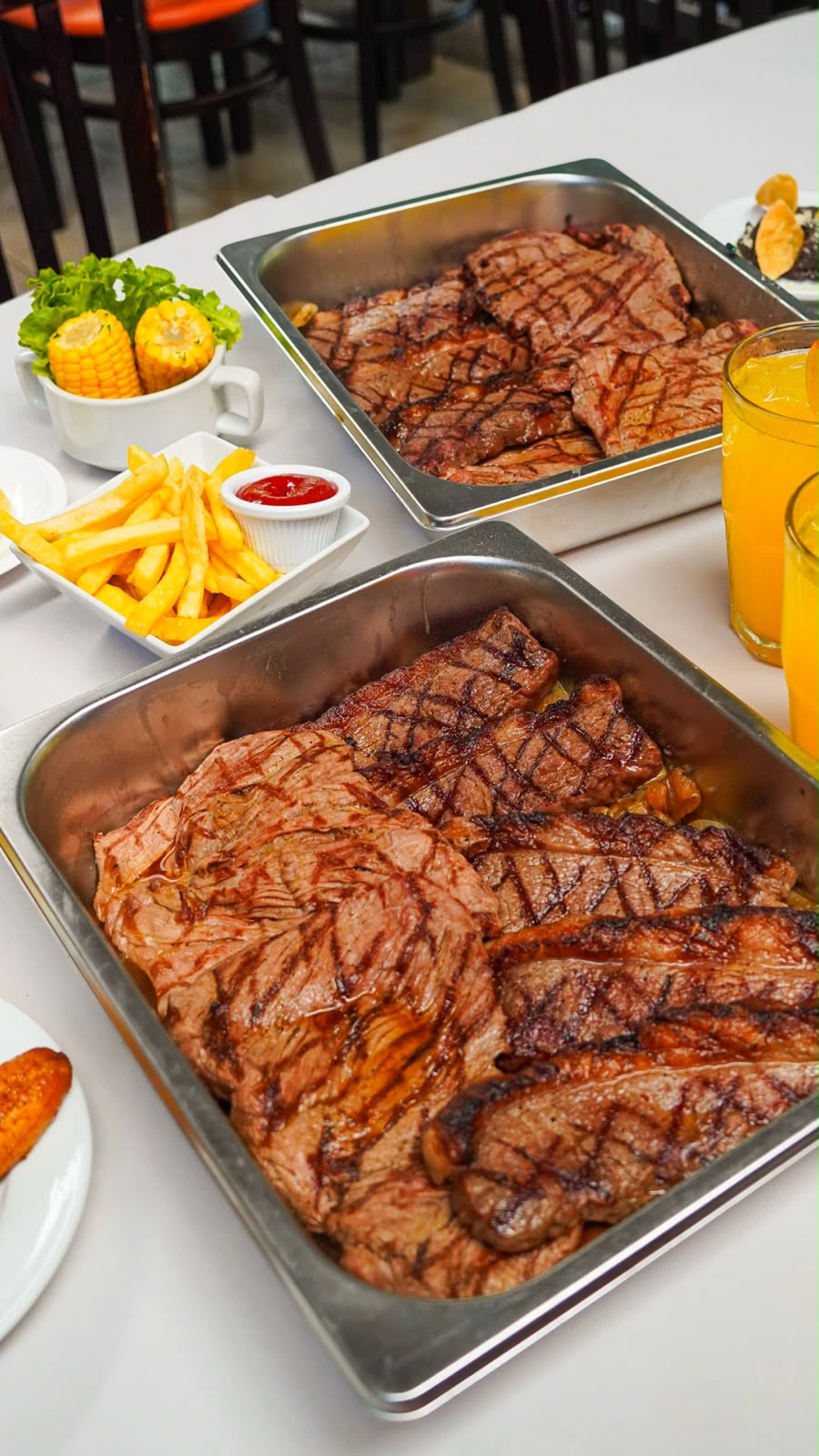 Cortes de carne a la parrilla de Entre Brasas